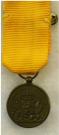 Draagminiatuur van de Medaille voor Trouwe Dienst bij de Koninklijke Landmacht. Brons, 12 jaar. Periode: Juliana, diameter 16mm. Prijs: .20,-