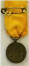 Keerzijde van de Draagminiatuur van de Medaille voor Trouwe Dienst bij de Koninklijke Landmacht. Brons, 12 jaar. Periode: Juliana, diameter 16mm. 
