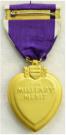 USA: Purple Heart Medal. For those wounded or killed as result of enemy action. Maker: Lordship Industries. Ingesteld 1932. Afb: George Washington. Prijs: .135,-