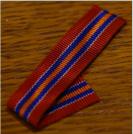 Lint voor miniatuurmedaille of kruis van de Bond van Nederlandse Militaire Oorlogsslachtoffers. Prijs: �.