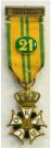 Kruis voor Betoonde Marsvaardigheid (Vierdaagsekruis). Ge�mailleerde versie met cijfer 21 voor 21e deelname. Maker: W. v. Veluw BV Zeist. Prijs: �.85,-